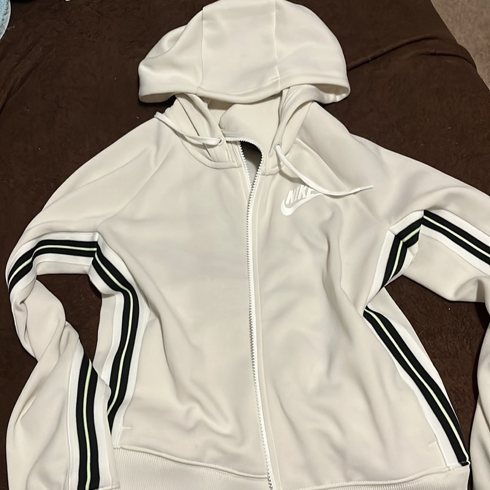 Cream/off-white Nike jacket w/ black and green stripe down the side